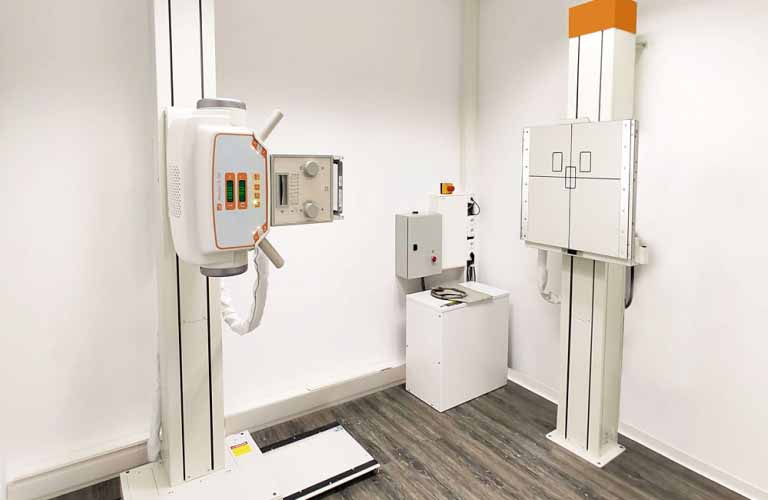 X-ray system for confined spaces for thoracic images and other x-rays of standing patients